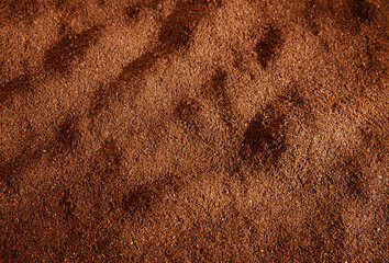 Textured background from ground coffee.