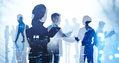 Business people, silhouettes and technology, office buildings at night