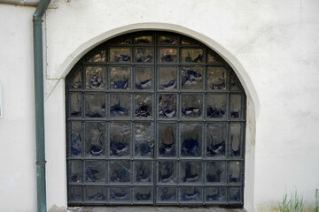 Old wooden frame and broken glass window on an old building for renovation
