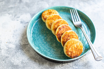 pancakes curd breakfast cottage cheese dessert cheesecake sweet syrniki healthy meal top view copy...