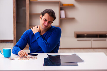 Young sick man suffering at home