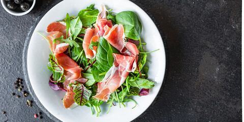 salad ham pork meat Dry meat jamon Italian Prosciutto Serrano, Bellota, Crudo or Parma portion on the table meal top view copy space healthy food background