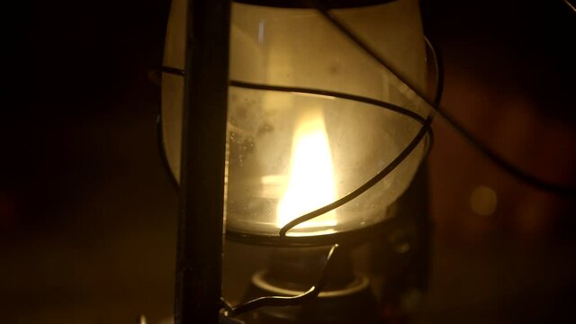Close up of oil lamp, light blows out at the end of the clip