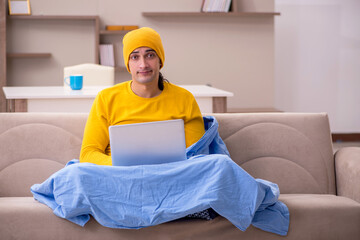 Young man freelancer suffering at home