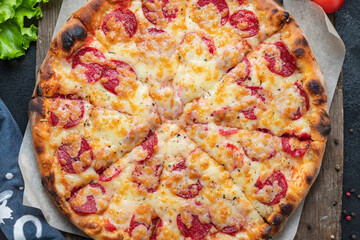 pizza sausage tomato sauce cheese trend fast food meal copy space rustic food background 