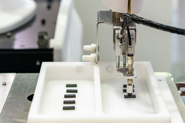 High technology accuracy automation system robot arm with vacuum sucker cup during sorting lift and place or arrange ic chip workpiece in box