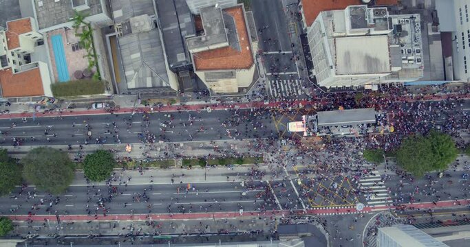 Aerial Birds Eye Shot Of People Walking During Gay Parade, Sao Paulo. Dolly Left