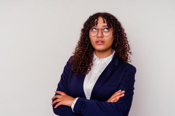 Young business mixed race woman isolated on white background tired of a repetitive task.