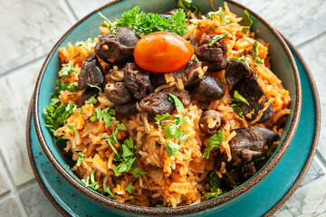  Indigenous Ghanaian, African-Caribian food Jollof Rice with tomato sause, regional spices, chicken meat and offal.