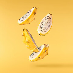 creative image with fresh yellow pitaya falling in the air, zero gravity food conception