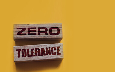 Zero tolerance - words from wooden blocks with letters, severely punishing all unacceptable...