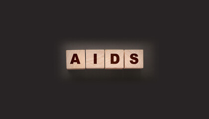 AIDS letters on wooden cubes. STD sexually transmitted diseases