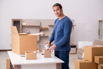 Young man moving to new flat