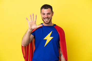 Super Hero Brazilian man isolated on yellow background counting five with fingers