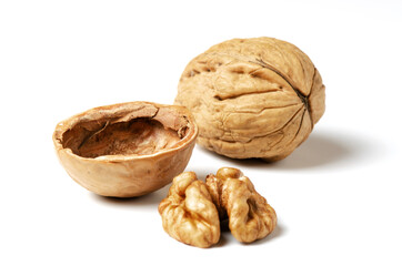 Walnuts on a white background. Nut - a source of vitamins and useful trace elements. Close up.