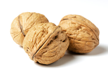 Walnuts on a white background. Nut - a source of vitamins and useful trace elements. Close up.