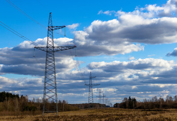 power lines on a sunny day against a blue sky
