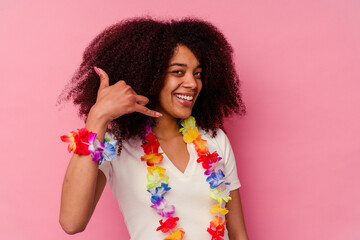 Young african american woman wearing a hawaiian stuff showing a mobile phone call gesture with...