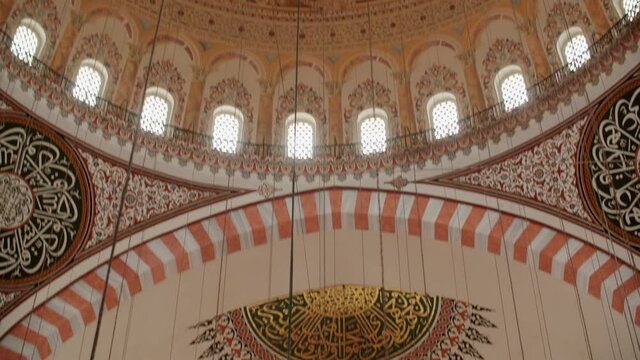 Art decor on dome vault inside islamic mosque. Religious drawings on the dome of an ancient mosque. Religious islamic architecture inside view