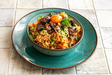  Indigenous Ghanaian, African-Caribian food Jollof Rice with tomato sause, regional spices, chicken meat and offal.