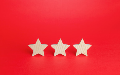 Three stars on a red background. Rating evaluation concept. Service quality. Buyer feedback. High...