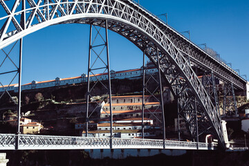 View of famous Dom Luis I Bridge at Ribeira in Porto, Portugal.