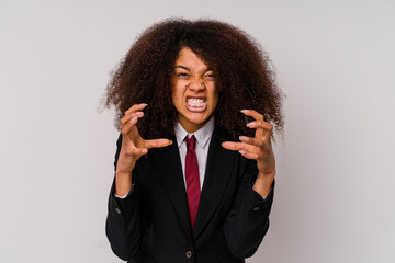 Young African American business woman wearing a suit isolated on white background upset screaming...