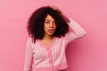 Young african american woman isolated on pink background being shocked, she has remembered important meeting.