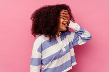 Young african american woman isolated on pink background covers eyes with hands, smiles broadly waiting for a surprise.