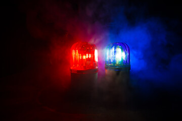 Police car blue and red round vintage siren in dark. Rotating retro style police siren in dark. © zef art