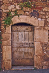 Fototapeta na wymiar Traditional wooden door in south of France