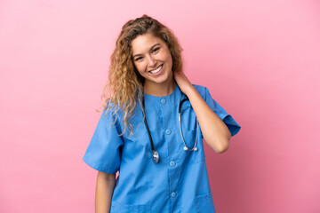 Young surgeon doctor woman isolated on pink background laughing