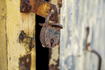 Old padlock with rust but fully functional photographed in the studio