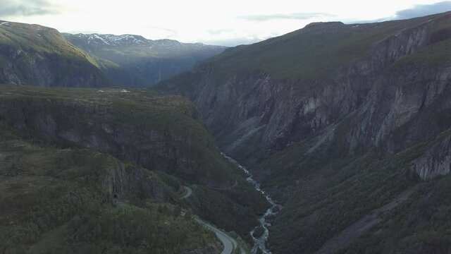 Road and river in mountains from aerial view