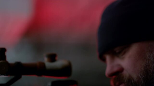 Sniper holding binoculars in hand. Secret agent using walkie talkie