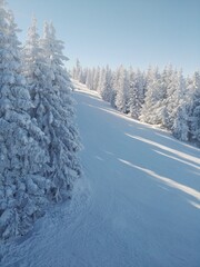 Empty ski slope with blue sky