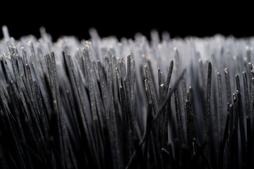 Macro photo of broom texture on dark background