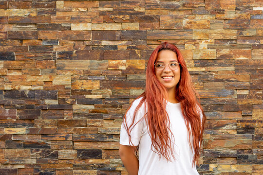 Young Woman With Big Smile And Sideways Glance