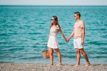 Young couple on white beach during summer vacation.