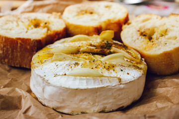 homemade DIY baked camembert with garlic.cheese with white mold.baked cheese.