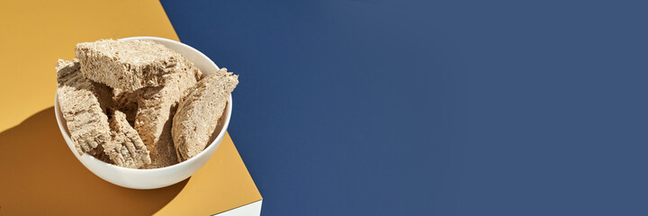 Halva concept. Trend turkish food. Sweet bakery. Cookies. Yummy dessert. Blue and yellow. Holiday recipe. Anniversary gourmet. Breakfast cake slice. Sunflower seeds