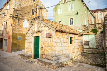 Fototapeta na wymiar St. Vinsent Church in old town of Vela Luka, Korcula island, Croatia