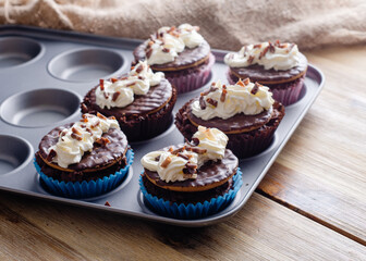 homemade chocolate cupcakes in cupcake mold on the table in the kitchen