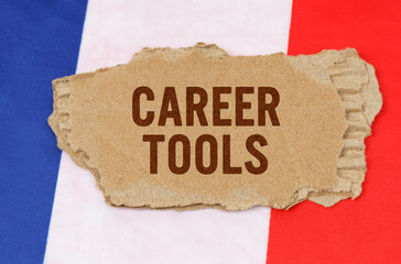 Against the background of the French flag lies cardboard with the inscription - Career Tools