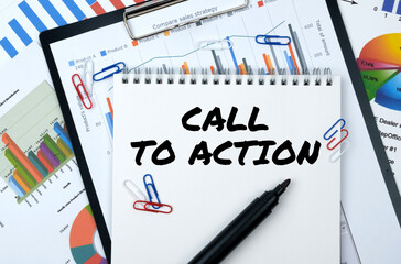 On the table are reports, charts, a notebook with the inscription - CALL TO ACTION