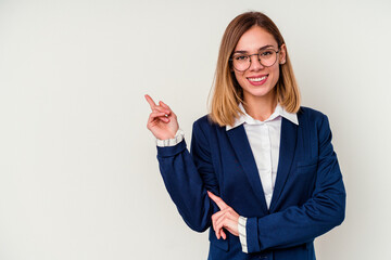 Young business caucasian woman isolated on white background smiling cheerfully pointing with forefinger away.