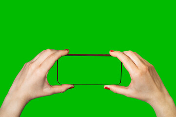 Mobile phone held by two hands chroma