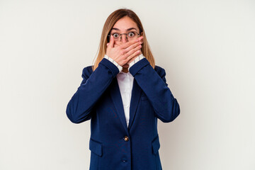 Young business caucasian woman isolated on white background shocked covering mouth with hands.