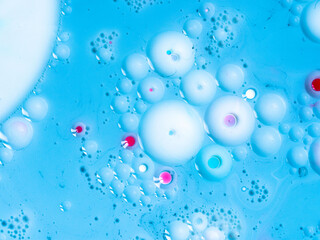 Beautiful oil colors of the universe. Bright colored bubbles sparkling. Abstract Acrylic Liquid Painting Texture. Macro Background Wallpaper. Oil Ink Acrylic Paint Spread Blast Explode Galaxy 