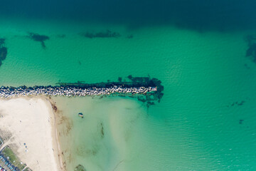 Breakwater and shipping canal at the entrance to Yuzhny port. Helicopter view.